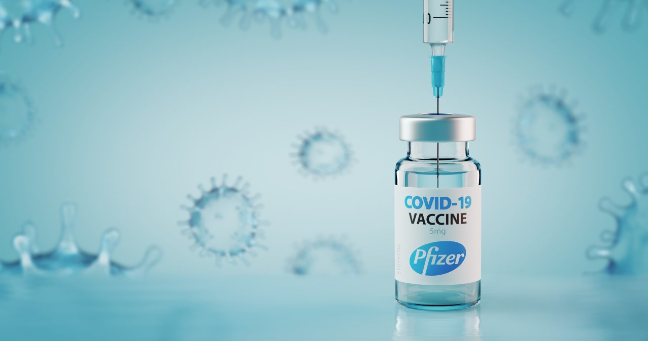 Sofia, Bulgaria - November 10, 2020: Pfizer COVID-19 Coronavirus Vaccine and Syringe. Conceptual image.